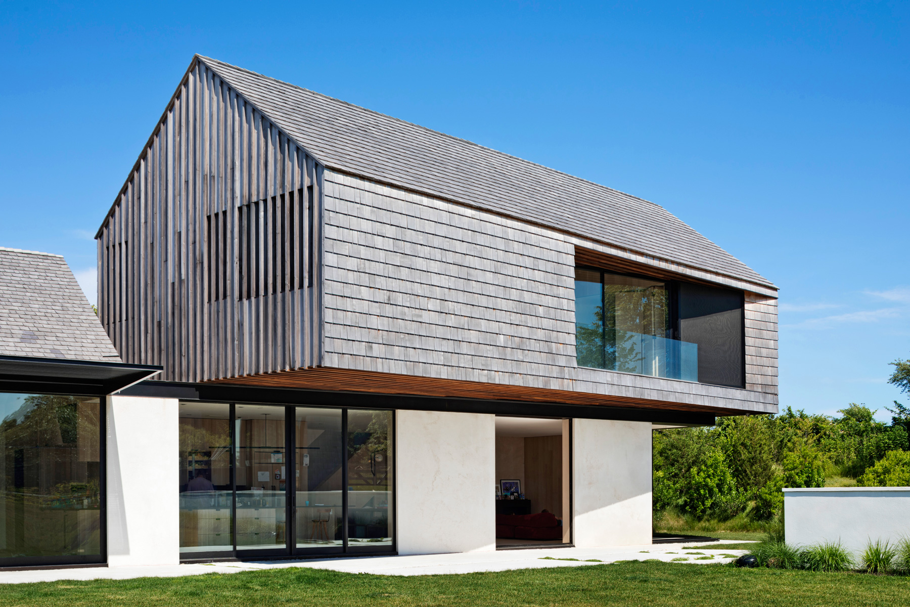 Residential cantilevered second-story gabled form
