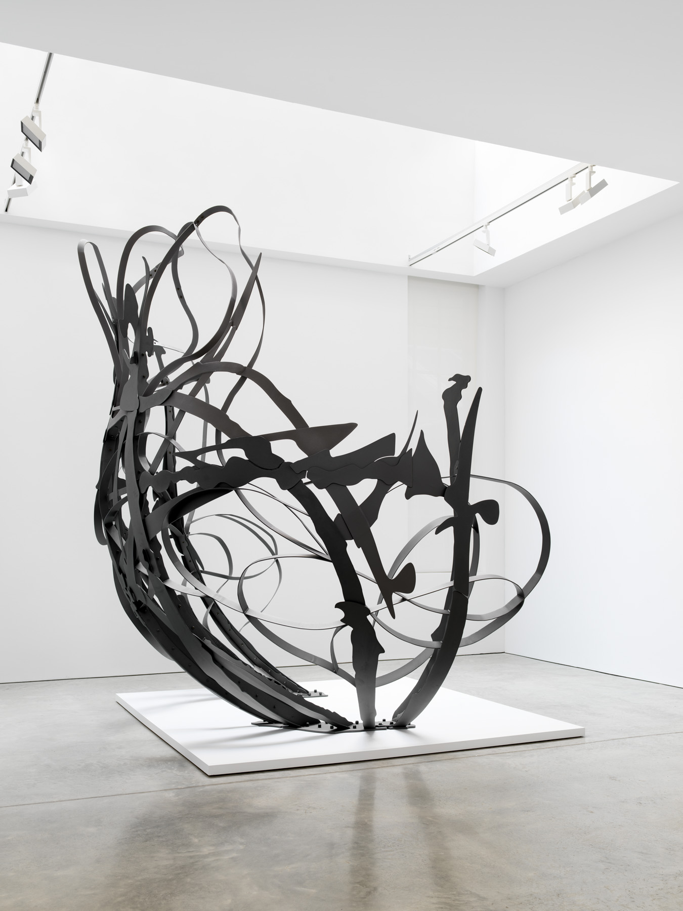 Laser-cut steel sculpture in gallery