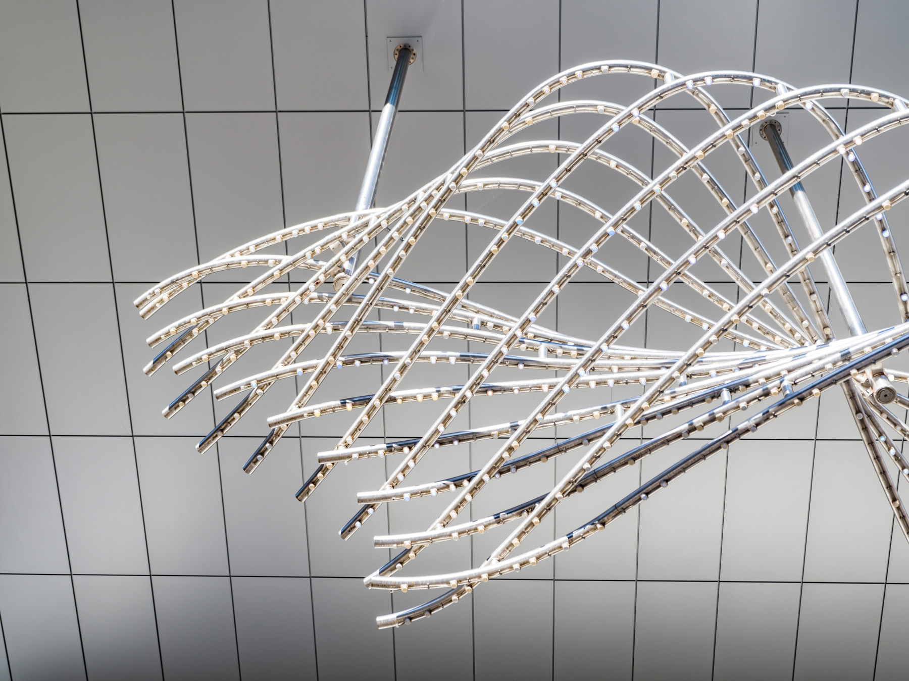 suspended metal light sculpture